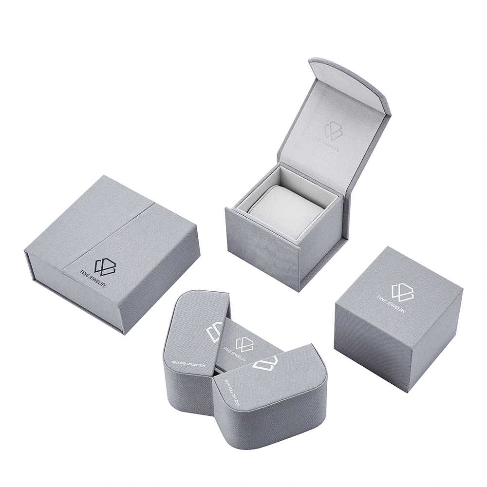 Grey textured jewelry packaging with fitted interiors