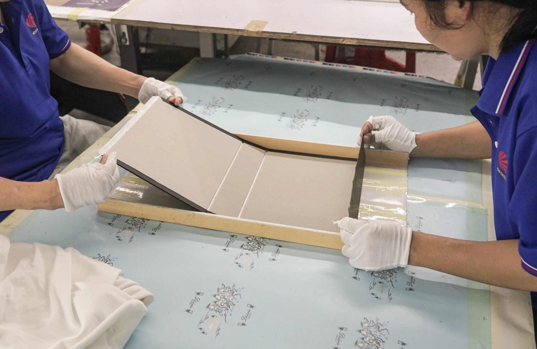 Rigid box wrapping and edge finishing by hand